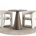 Round Wooden Table With Beige Armchairs And Black Metal Legs On Woven Rug