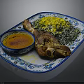 Roast Chicken Leg With Yellow Rice Green Vegetables And Sauce On Blue White Patterned Plate