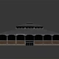 Brick Walled Building With Metal Roof Arched Windows Central Raised Roof Section And Symmetrical Design