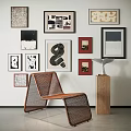 Stylish Photo Wall With Various Art Frames And Modern Wicker Chair By Wooden Pedestal