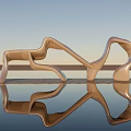 Modern Metal Sculpture with Curved Design in Outdoor Setting and Water Reflection