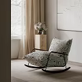 Neutral Toned Patterned Rocking Lounge Chair with Wooden Side Table Vase and Wall Art