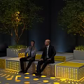 Yellow Public Chairs With Illuminated Design And Trees In Urban Setting