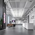 Store Front Desk With ADZ Logo White Counter Chandelier Sofa And Cactus In Spacious Lobby