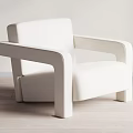 White Modern Single Sofa With Sleek Armrests And Comfortable Seat On Wooden Floor