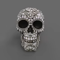 Intricate Skull Sculpture Carving With Detailed Floral Patterns And Decorative Design