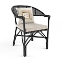 Stylish Natural Rattan Armchair With Red Geometric Cushion And Woven Accents
