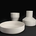 White Ceramic Bowl Plate Cup And Vase With Speckled Linear Design On Black Background