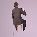 Man in suit sitting on wooden chair pointing upward with finger against light purple background