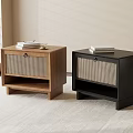 Two Brown And Black Nightstands With Woven Panels And Books On Top