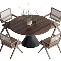 Round Wooden Dining Table With Four Woven Chairs Black Cone Base and Decor Plant Centerpiece