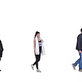 Group of people walking indoors on wooden floor with light colored wall background