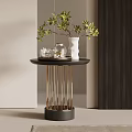Side Table With Black Top Golden Metal Legs Green Plant White Vase And Glass Jar