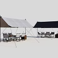 Outdoor Camping Tents With Gray And Black Canopies And Seating Furniture