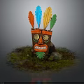 Tribal Wooden Mask With Red Blue Yellow Green Feathers Golden Eyes And Green Leaf On Grass With Stones
