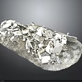 Collection of White Broken Stone Fragments on Tray with Dark Background
