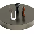 Round Dark Gray Coffee Table With Decorative Sculptures Dried Plant And Modern Ornaments