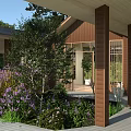 Traditional Wooden Ancient Building With Sloped Roof Large Windows And Greenery Surroundings
