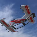 Red and White Rescue Aircraft With 112 Marking Flying in Blue Sky