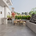 Balcony Garden With Gray Tile Floor Dining Table Chairs Green Plants Rockery And Small Waterfall