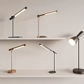 Multiple Stylish Modern Table Lamps With Different Designs On White Shelves