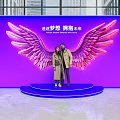 Popular Photo Check In Spot With Pink Wings Blue Platform And People Posing