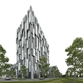 Modern Office Building Exterior With Geometric Glass Facade And Surrounding Trees Under Blue Sky