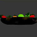 Colorful Chili Peppers On Black Plate With Red Green And Orange Varieties