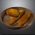 Three Golden Brown Roasted Sweet Potatoes in Wooden Plate on Dark Background