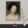 Interior Decor Featuring Blurred Female Portrait On Wall White Vase With Green Branches