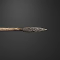Ancient Primitive Spear With Intricate Carved Spearhead And Wooden Shaft Design