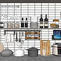 Hanging Kitchen Utensils and Cookware with Spice Jars Wooden Cutting Boards on White Grid Wall