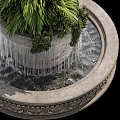 Garden Ornament Fountain With Decorative Stone Base Green Plants And Flowing Water