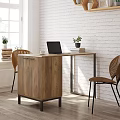 Modern Wooden Desk With Laptop Cup Books Plant And Woven Back Chairs By Brick Wall