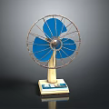 Tabletop Electric Fan With Blue Blades Metal Grill And Stable Base Design