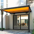 Modern Building Entrance With Orange Awning Black Frame Glass Door And Green Plants