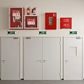 Fire Safety Equipment And Emergency Doors With Green Signs On White Wall