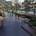 Modern Garden Landscape With Trees Canopy Paved Pathway Seating Stone Wall And Greenery