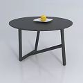 Round Black Coffee Table Featuring White Plate With Yellow Lemon On Top 3d model