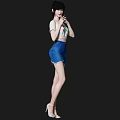 Woman With Short Hair Wearing White T-shirt And Blue Denim Shorts Standing In High Heels