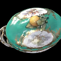 Ornate Green Lidded Ceramic Vessel With Fruit Shaped Handle Golden Accents And Decorative Patterns