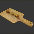 Three Orange Food Chunks Arranged On Wooden Cutting Board Surface