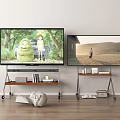 Two TVs On Wheeled Stands Display Scenery With Books And Decorative Items