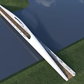 Modern White Streamlined Bridge Spanning Water With Green Grass Blue Sky And White Clouds