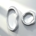 Two Irregular Shaped Golden Mirrors On White Wall With Shadow Effects