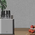 Kitchen Knife Block With Black Knives Scissors On Wooden Countertop With Fruit Bowl And Tomatoes