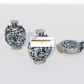 Traditional Blue And White Ceramic Vessels With Floral Patterns And Vase Shapes