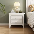 White Wooden Nightstand With Two Drawers Lamp Books And Teacup By Bedside Green Plant