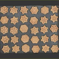 Assorted Shaped Cookies Neatly Arranged On Black Tray With Star And Snowflake Designs
