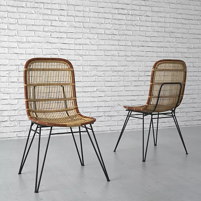Modern Rattan Leisure Chairs With Black Metal Legs Against White Brick Wall 3d model